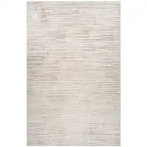 Photo of Gray and Beige Geometric Distressed Area Rug