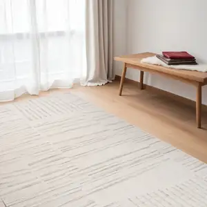 Photo of Gray and Beige Geometric Distressed Area Rug