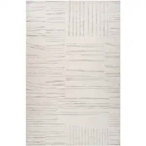 Photo of Gray and Beige Geometric Distressed Area Rug