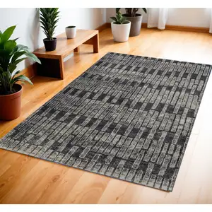 Photo of Gray and Black Geometric Power Loom Worn Faded Area Rug