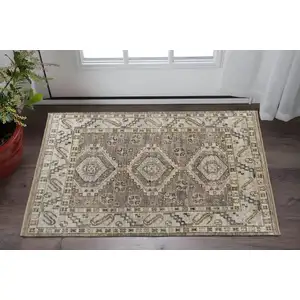 Photo of Gray and Brown Wool Geometric Hand Knotted Area Rug With Fringe