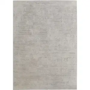 Photo of Gray and Ivory Abstract Hand Woven Worn Faded Area Rug