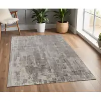 Photo of Gray and Ivory Abstract Hand Woven Worn Faded Area Rug