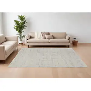 Photo of Gray and Ivory Abstract Hand Woven Worn Faded Area Rug