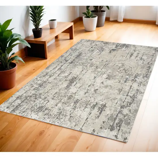 Gray and Ivory Abstract Power Loom Area Rug Photo 1