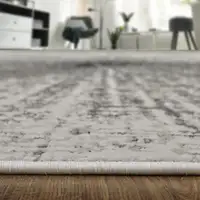 Photo of Gray and Ivory Abstract Power Loom Area Rug