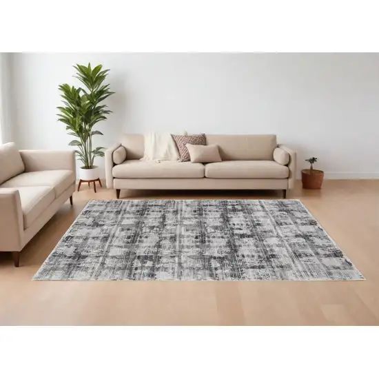 Gray and Ivory Abstract Power Loom Area Rug Photo 1