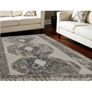 Photo of Gray and Ivory Abstract Power Loom Worn Faded Area Rug