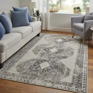 Photo of Gray and Ivory Abstract Power Loom Worn Faded Area Rug