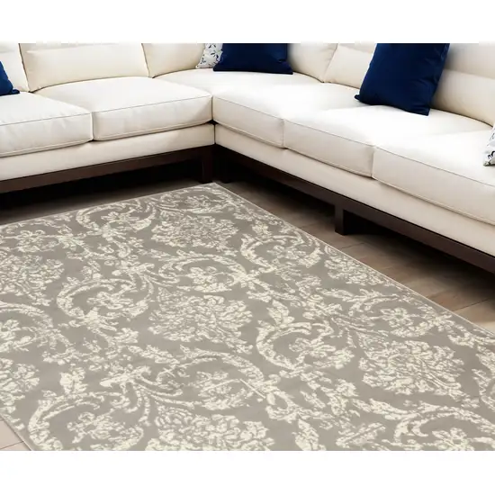 Gray and Ivory Damask Power Loom Distressed Area Rug Photo 1