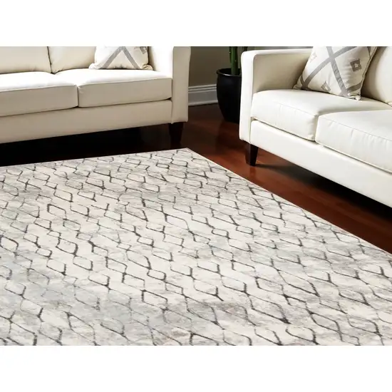 Gray and Ivory Geometric Power Loom Worn Faded Area Rug Photo 1