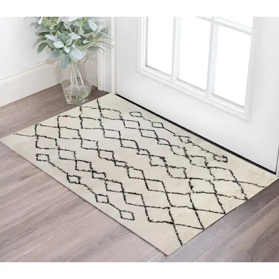 Ivory and Black Geometric Shag Area Rug Photo 1