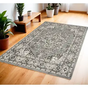 Photo of Gray and Ivory Medallion Power Loom Distressed Area Rug