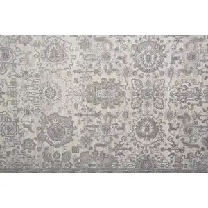 Photo of Gray and Ivory Oriental Power Loom Worn Faded Area Rug With Fringe