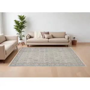 Photo of Gray and Ivory Oriental Power Loom Worn Faded Area Rug With Fringe