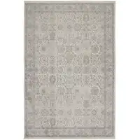 Photo of Gray and Ivory Oriental Power Loom Worn Faded Area Rug With Fringe