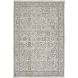 Photo of Gray and Ivory Oriental Power Loom Worn Faded Area Rug With Fringe