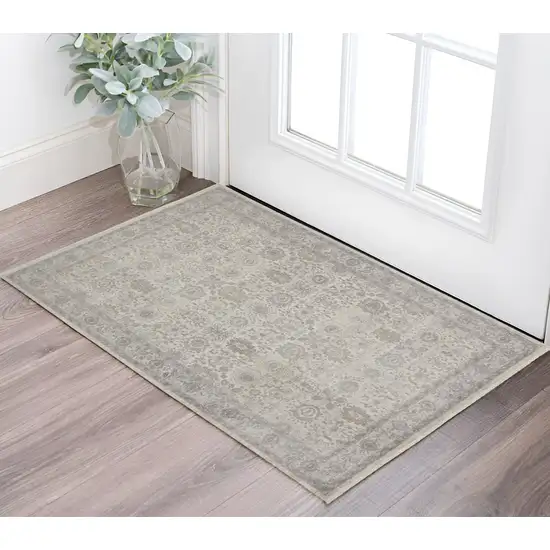 Gray and Ivory Oriental Power Loom Worn Faded Area Rug With Fringe Photo 1