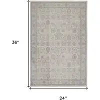 Photo of Gray and Ivory Oriental Power Loom Worn Faded Area Rug With Fringe