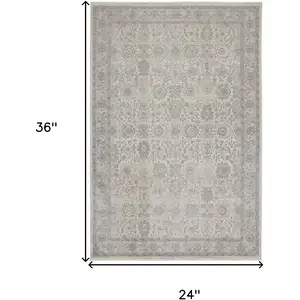 Photo of Gray and Ivory Oriental Power Loom Worn Faded Area Rug With Fringe