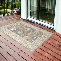 Photo of Gray and Orange Floral Stain Resistant Indoor Outdoor Area Rug