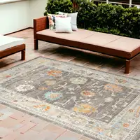 Photo of Gray and Orange Floral Stain Resistant Indoor Outdoor Area Rug