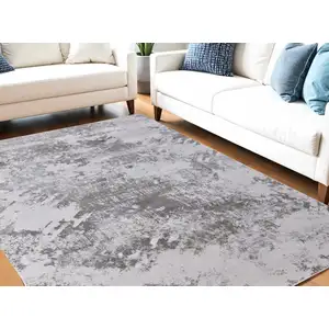 Photo of Gray and Silver Abstract Power Loom Worn Faded Area Rug