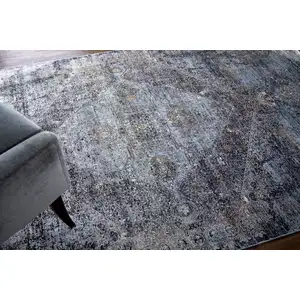 Photo of Gray and Silver Abstract Power Loom Worn Faded Area Rug