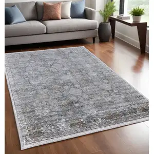 Photo of Gray and Silver Damask Power Loom Worn Faded Area Rug