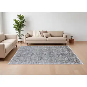 Photo of Gray and Silver Damask Power Loom Worn Faded Area Rug