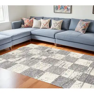 Photo of Gray and White Checkered Power Loom Distressed Area Rug