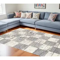 Photo of Gray and White Checkered Power Loom Distressed Area Rug