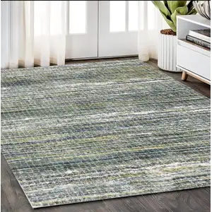 Photo of Green And Blue Geometric Distressed Area Rug