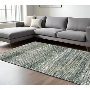 Photo of Green And Blue Geometric Distressed Area Rug