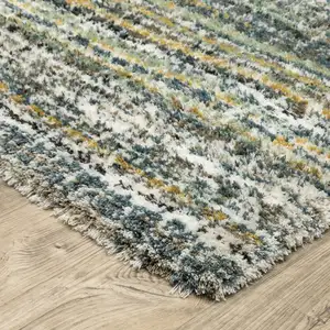 Photo of Green And Blue Geometric Distressed Area Rug