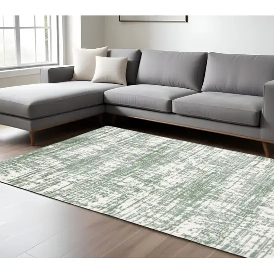 Green And Ivory Abstract Area Rug Photo 1