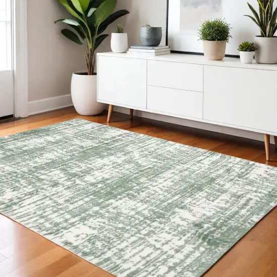 Green And Ivory Abstract Area Rug Photo 1