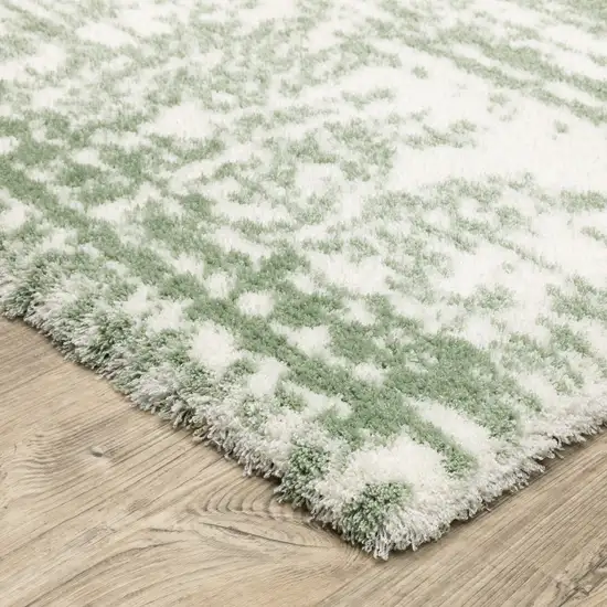 Green And Ivory Abstract Area Rug Photo 9