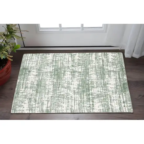 Green And Ivory Abstract Area Rug Photo 1