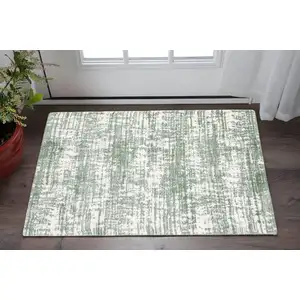 Photo of Green And Ivory Abstract Area Rug