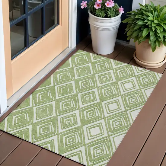 Green And Ivory Geometric Washable Indoor Outdoor Area Rug Photo 1