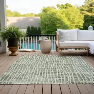 Photo of Green And Ivory Striped Washable Indoor Outdoor Area Rug