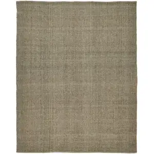 Photo of Green And Tan Hand Woven Area Rug