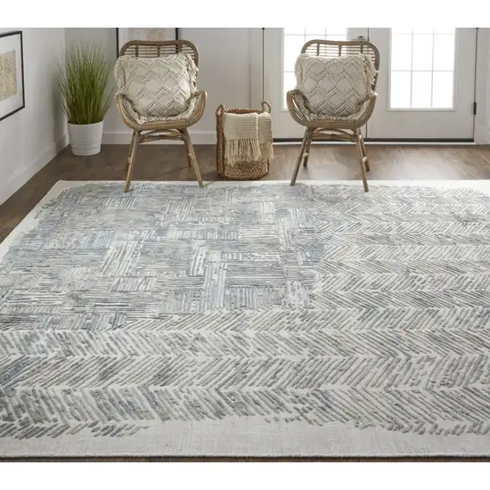 Green Blue And Ivory Abstract Hand Woven Distressed Area Rug Photo 7