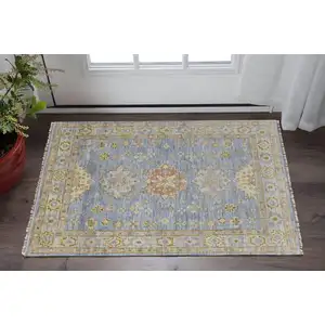 Photo of Green Blue and Yellow Wool Geometric Hand Knotted Area Rug With Fringe