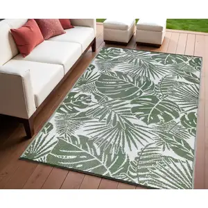 Photo of Green Floral Machine Braided Distressed Area Rug With UV Protection