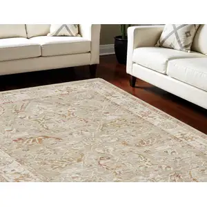 Photo of Green Floral Power Loom Distressed Area Rug With Fringe