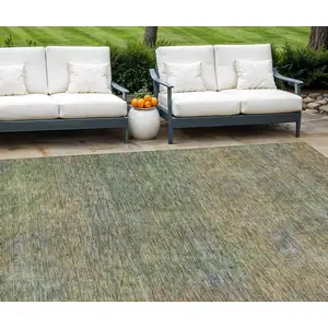 Photo of Green Gold And Charcoal Abstract Washable Indoor Outdoor Area Rug