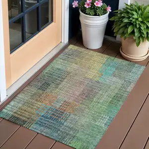 Photo of Green Gold And Teal Blue Abstract Washable Indoor Outdoor Area Rug