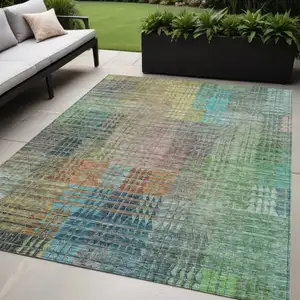 Photo of Green Gold And Teal Blue Abstract Washable Indoor Outdoor Area Rug